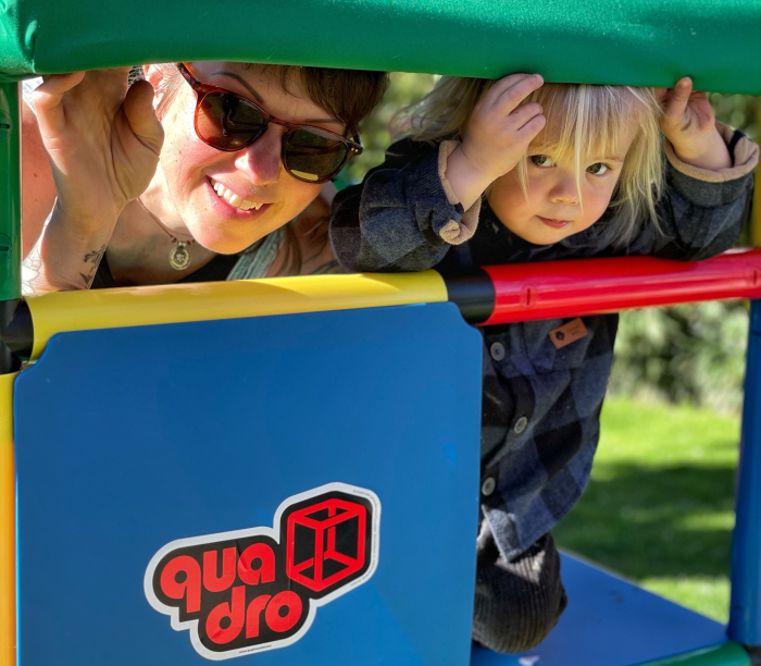 Woman with child on QUADRO jungle gym