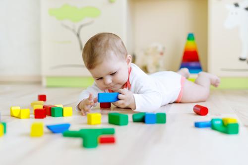Baby with wooden blocks