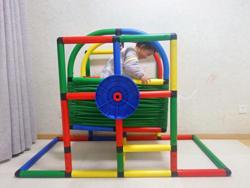 Boy playing on jungle gym